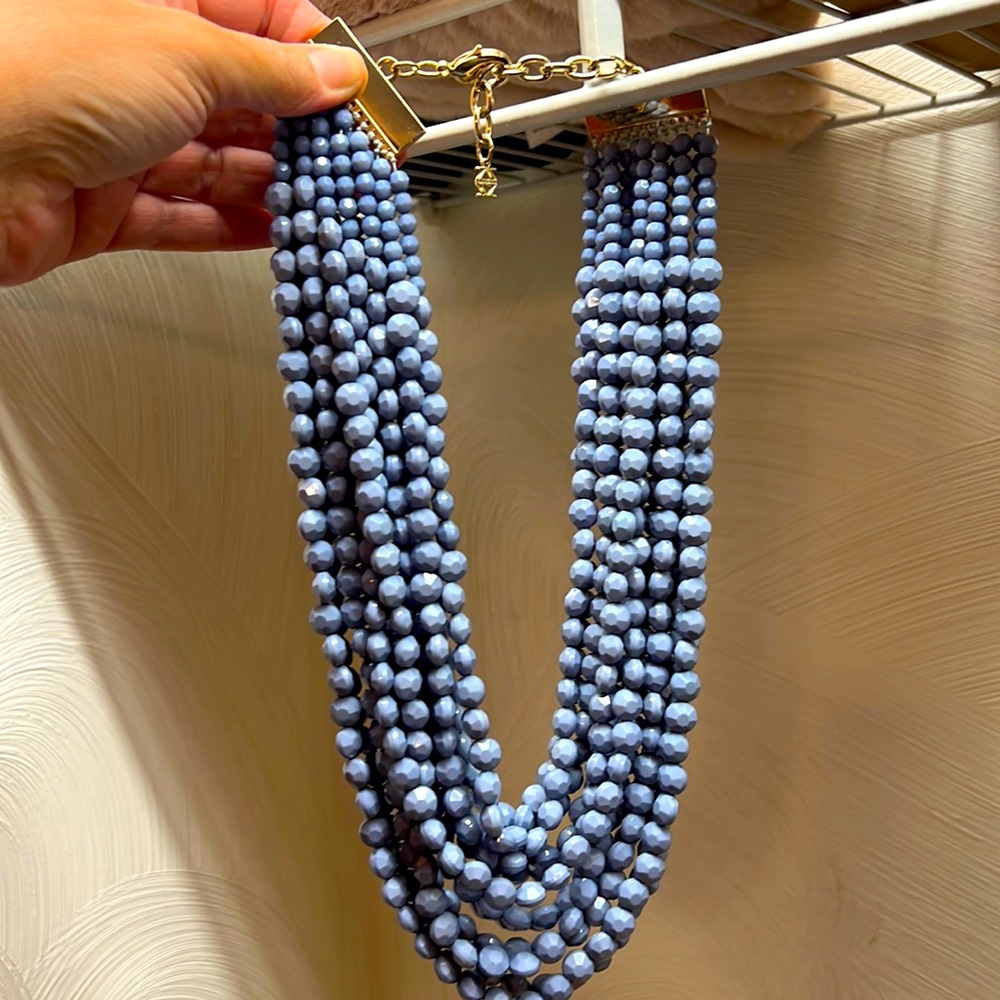 Beaded necklace in Periwinkle, gold accents on clasps.